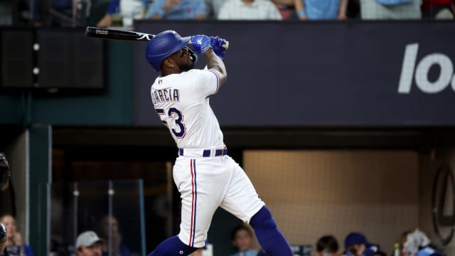 Oct 20, 2023; Arlington, Texas, USA; Texas Rangers right fielder Adolis Garcia (53) hits a three-run home run during the sixth inning of game five in the ALCS against the Houston Astros for the 2023 MLB playoffs at Globe Life Field. Mandatory Credit: Kevin Jairaj-USA TODAY Sports